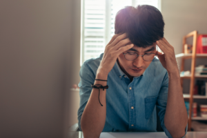 Stressed IB student at desk