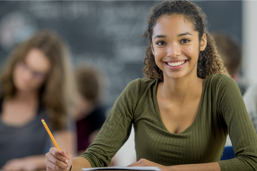 happy student at desk