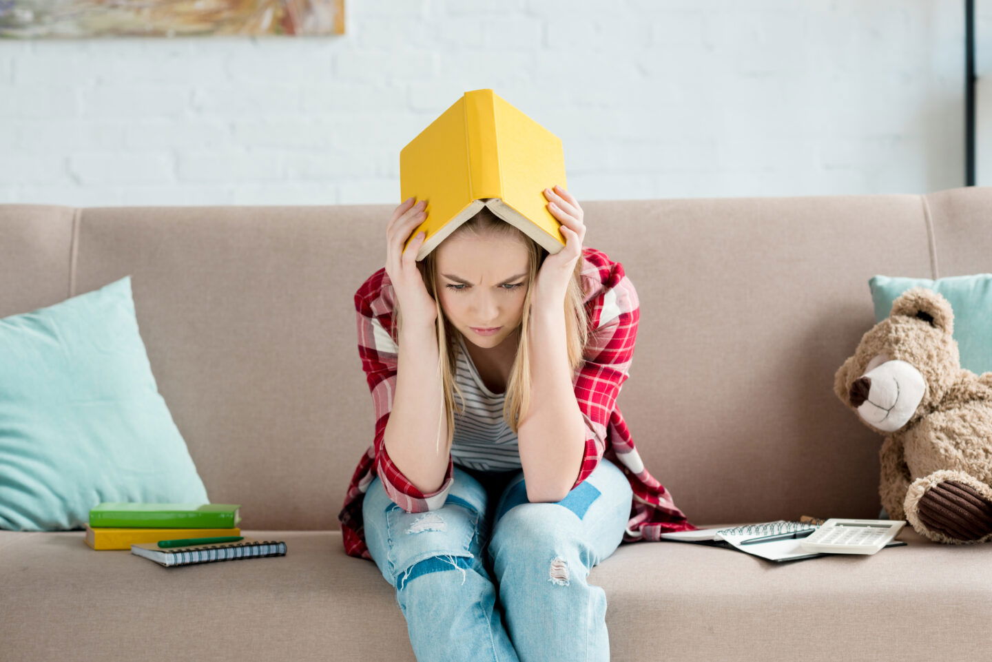 Stressed Extended Essay Student on couch at home