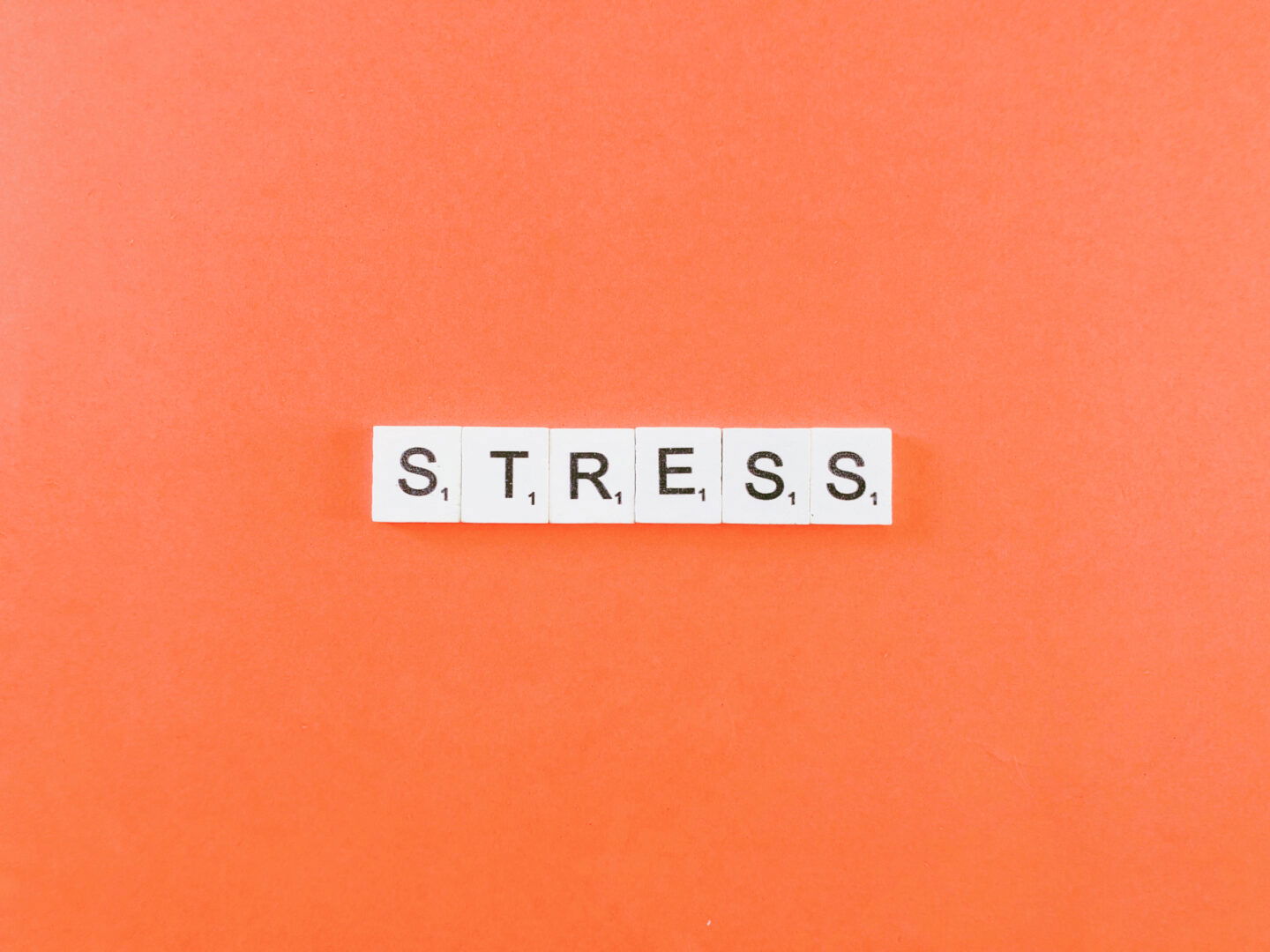 Stress - Tiles on orange background