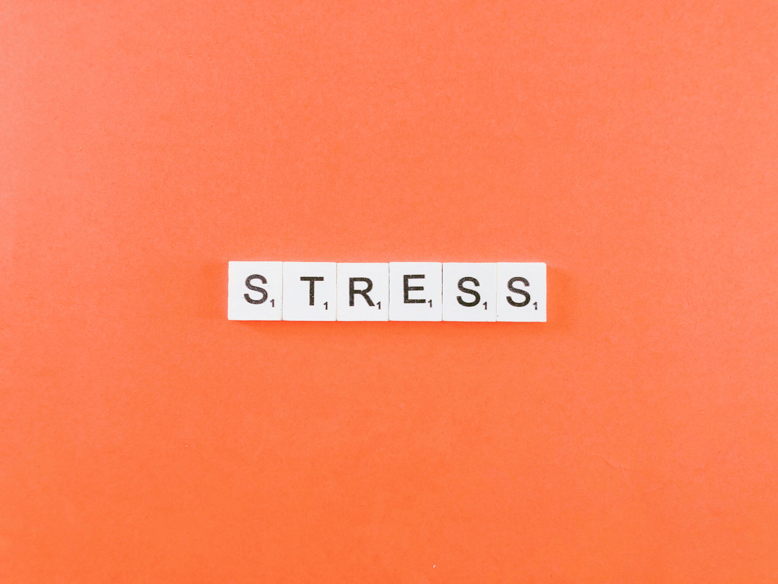 Stress - Tiles on orange background